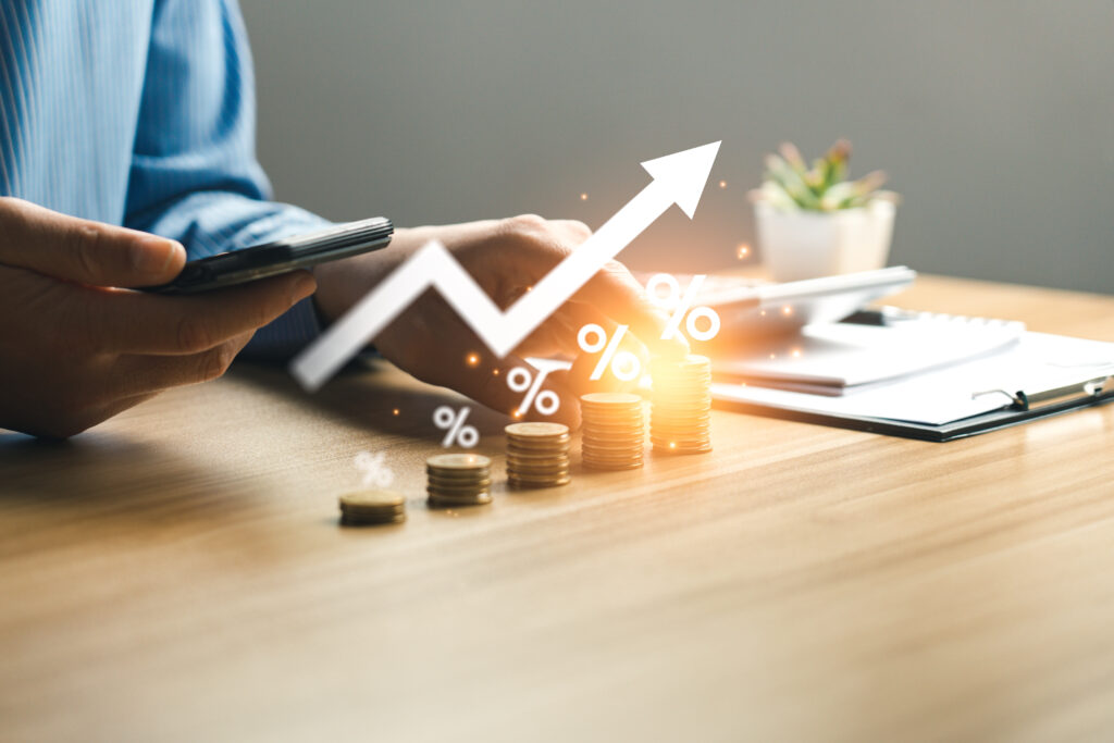 interest rate and dividend concept, businessman is calculating income and return on investment in percentage. income, return, retirement, compensation fund, investment, dividend tax, stock market